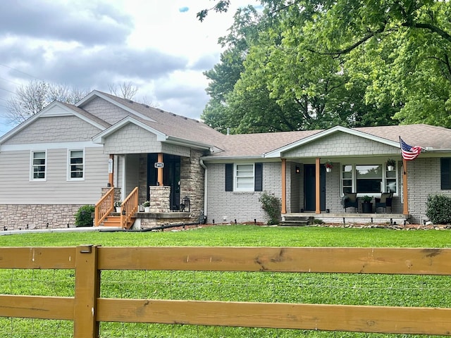 5935 S New Hope Rd, Hermitage, TN 37076 - view of front of house with covered porch, brick siding, and a shingled roof
