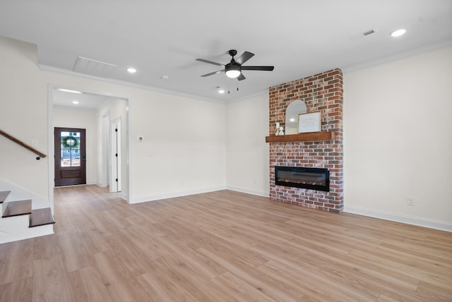 583 Pongracz Way, Clarksville, TN 37042 - unfurnished living room featuring stairway, a fireplace, light wood-type flooring, ceiling fan, and ornamental molding