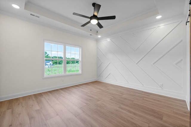 583 Pongracz Way, Clarksville, TN 37042 - empty room featuring ornamental molding, a raised ceiling, ceiling fan, light wood finished floors, and baseboards