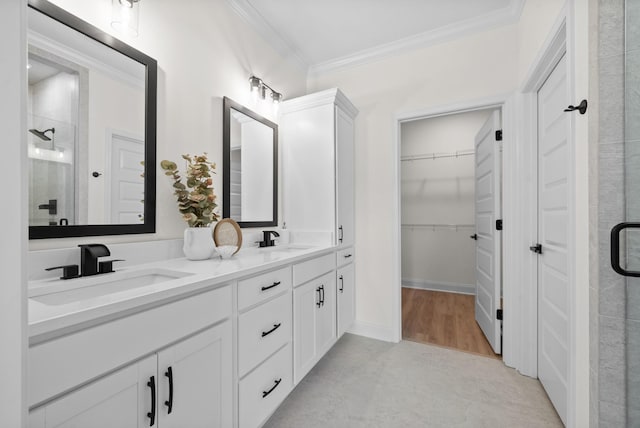 583 Pongracz Way, Clarksville, TN 37042 - bathroom featuring ornamental molding, a shower stall, double vanity, a walk in closet, and baseboards