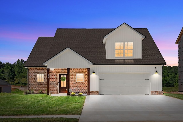 583 Pongracz Way, Clarksville, TN 37042 - view of front of home featuring a garage, driveway, a front lawn, brick siding, and roof with shingles