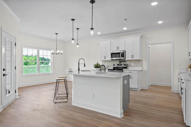 583 Pongracz Way, Clarksville, TN 37042 - kitchen featuring stainless steel appliances, ornamental molding, a sink, light countertops, and white cabinets