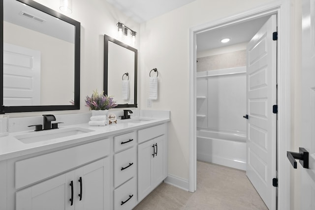 583 Pongracz Way, Clarksville, TN 37042 - full bath featuring double vanity, tile patterned floors, shower / bath combination, and baseboards