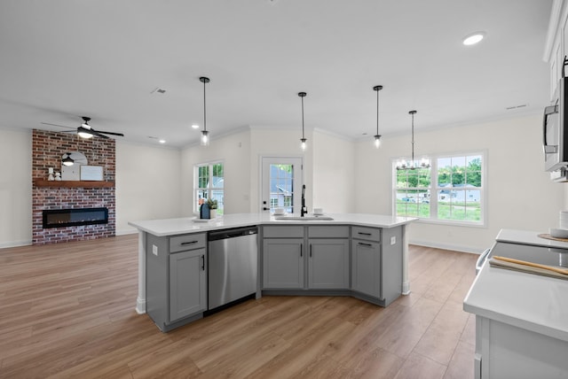 583 Pongracz Way, Clarksville, TN 37042 - kitchen featuring dishwasher, a sink, gray cabinets, open floor plan, and light countertops