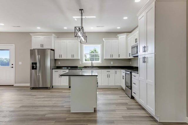 115 Carl Williams Rd, Crofton, KY 42217 - kitchen featuring appliances with stainless steel finishes, a sink, dark countertops, recessed lighting, and a kitchen island