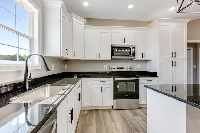115 Carl Williams Rd, Crofton, KY 42217 - kitchen featuring stainless steel appliances, a sink, white cabinetry, light wood-style floors, and recessed lighting