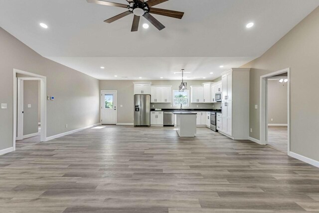 115 Carl Williams Rd, Crofton, KY 42217 - unfurnished living room with ceiling fan, baseboards, light wood finished floors, recessed lighting, and a sink