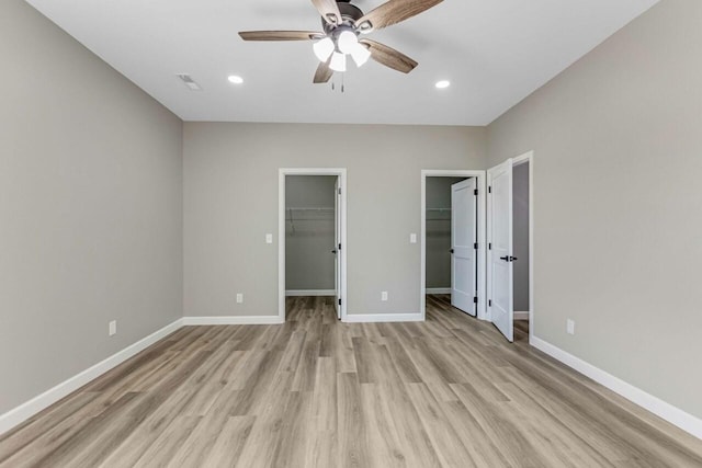 115 Carl Williams Rd, Crofton, KY 42217 - unfurnished bedroom featuring light wood-type flooring, a walk in closet, baseboards, recessed lighting, and a ceiling fan