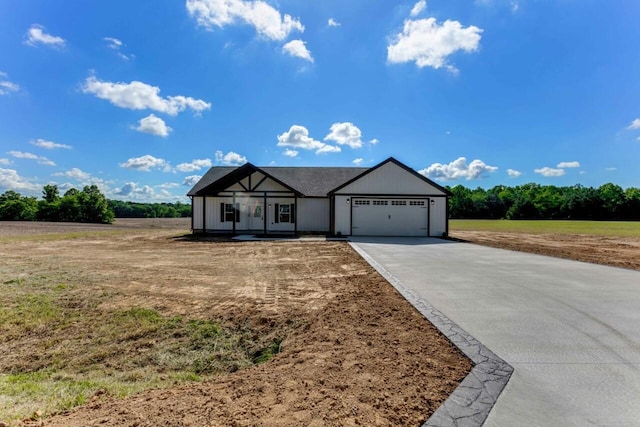 115 Carl Williams Rd, Crofton, KY 42217 - view of front of property featuring concrete driveway and an attached garage
