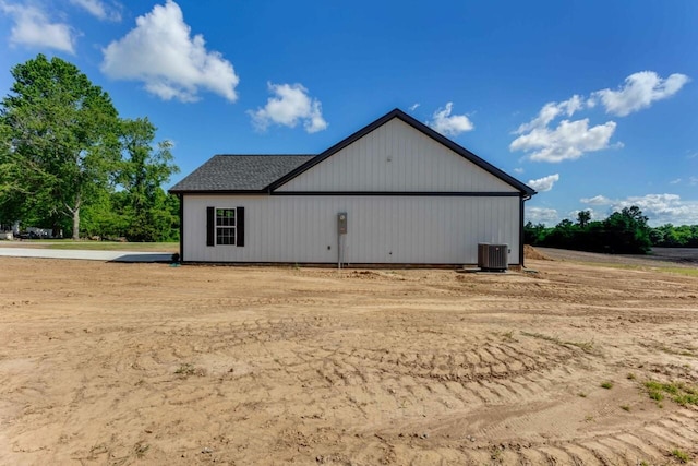 115 Carl Williams Rd, Crofton, KY 42217 - view of side of home featuring central AC, a pole building, and an outbuilding