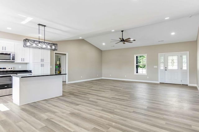 115 Carl Williams Rd, Crofton, KY 42217 - kitchen with stainless steel appliances, baseboards, open floor plan, light wood-type flooring, and white cabinets