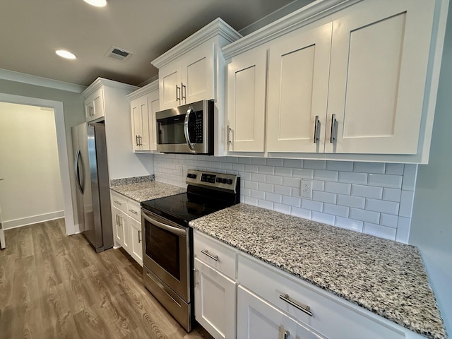 5608 Maples Retreat Dr, Murfreesboro, TN 37127 - kitchen featuring stainless steel appliances, white cabinets, dark wood-style floors, light stone counters, and tasteful backsplash