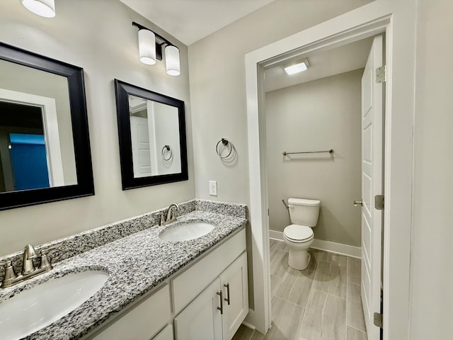 5608 Maples Retreat Dr, Murfreesboro, TN 37127 - bathroom featuring double vanity, baseboards, and toilet