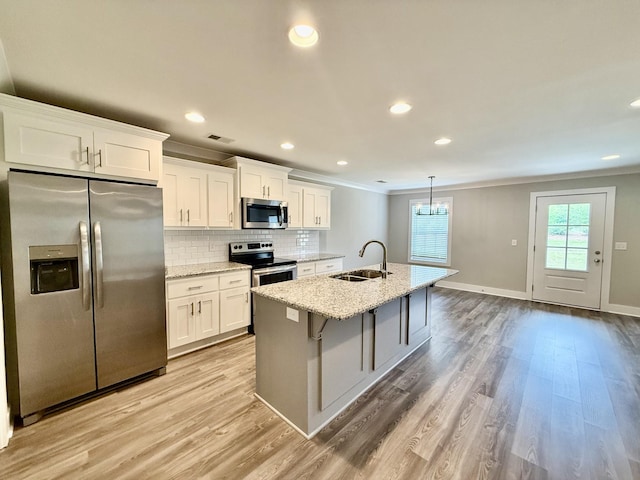 5608 Maples Retreat Dr, Murfreesboro, TN 37127 - kitchen featuring stainless steel appliances, a sink, crown molding, white cabinets, and tasteful backsplash