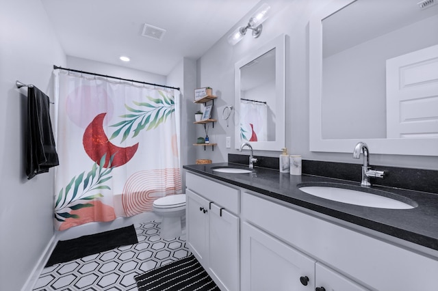 4010 Planters Trl, Mount Juliet, TN 37122 - full bath featuring double vanity, toilet, a shower with shower curtain, and tile patterned floors