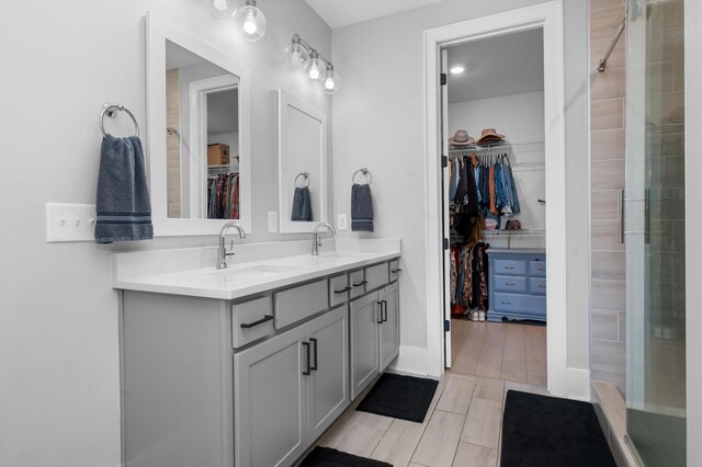 4010 Planters Trl, Mount Juliet, TN 37122 - full bathroom featuring a spacious closet, double vanity, a shower stall, and tile patterned flooring