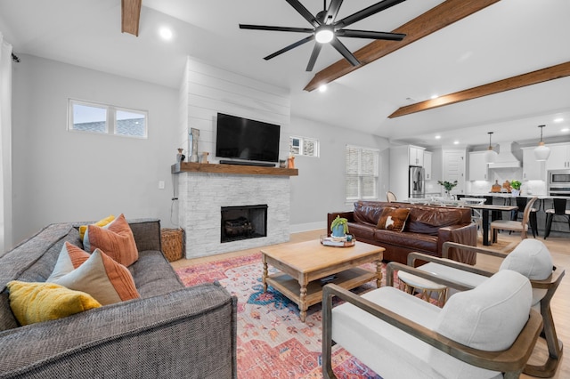 4010 Planters Trl, Mount Juliet, TN 37122 - living room featuring a ceiling fan, recessed lighting, a stone fireplace, and light wood-style floors