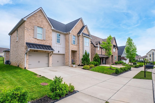4010 Planters Trl, Mount Juliet, TN 37122 - view of front of home featuring driveway, an attached garage, a front lawn, brick siding, and a residential view