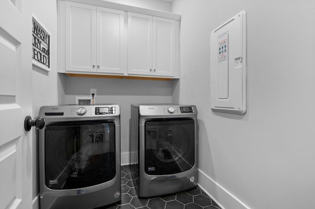 4010 Planters Trl, Mount Juliet, TN 37122 - laundry room with independent washer and dryer, cabinet space, dark tile patterned flooring, and baseboards