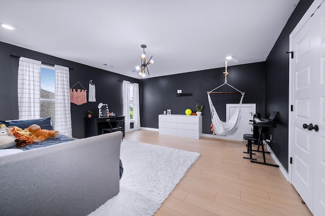 4010 Planters Trl, Mount Juliet, TN 37122 - bedroom with an accent wall, light wood finished floors, recessed lighting, a chandelier, and baseboards