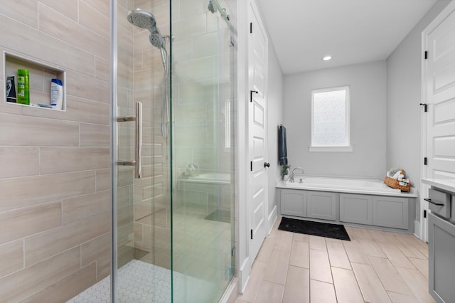4010 Planters Trl, Mount Juliet, TN 37122 - bathroom with a bath, a shower stall, and recessed lighting