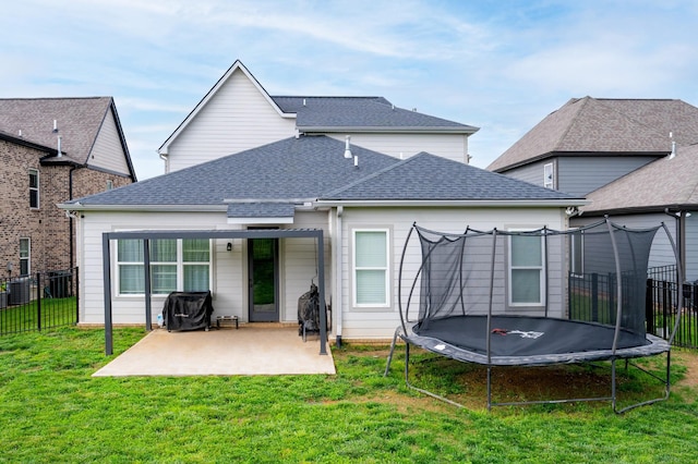 4010 Planters Trl, Mount Juliet, TN 37122 - back of property with a trampoline, a patio, and a shingled roof