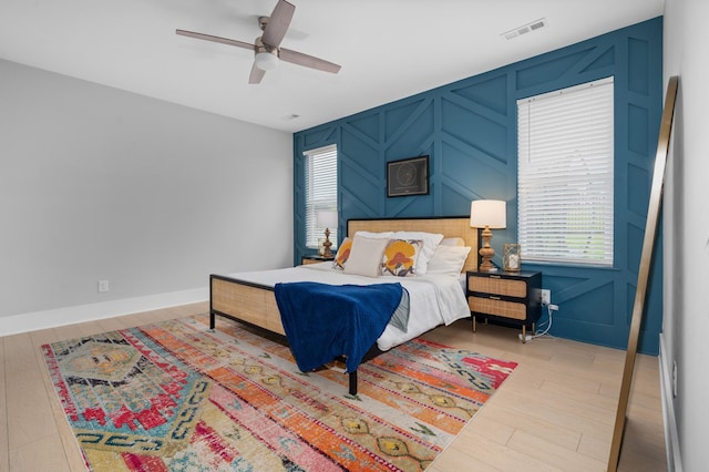 4010 Planters Trl, Mount Juliet, TN 37122 - bedroom with a decorative wall, wood finished floors, and a ceiling fan