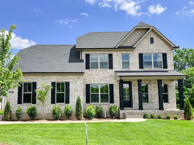 220 Settlers Way, Hendersonville, TN 37075 - craftsman house with board and batten siding, brick siding, covered porch, a front yard, and roof with shingles