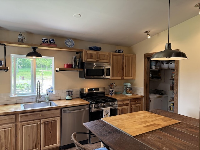 1829 Lobelville Hwy, Linden, TN 37096 - kitchen featuring appliances with stainless steel finishes, wood counters, a sink, decorative backsplash, and hanging light fixtures