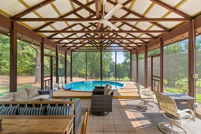 1829 Lobelville Hwy, Linden, TN 37096 - sunroom / solarium featuring outdoor lounge area, a jacuzzi, lofted ceiling, ceiling fan, and view of scattered trees