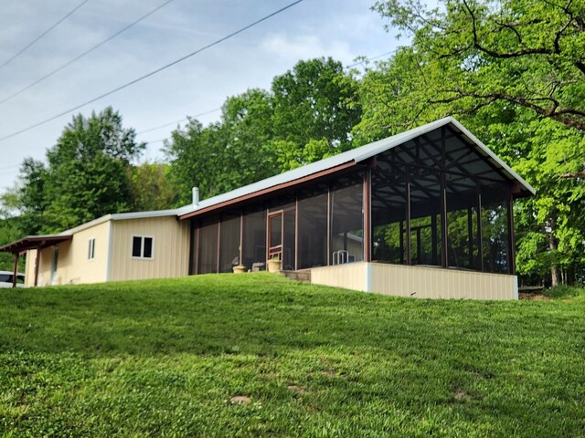 1829 Lobelville Hwy, Linden, TN 37096 - rear view of house featuring a sunroom and a yard
