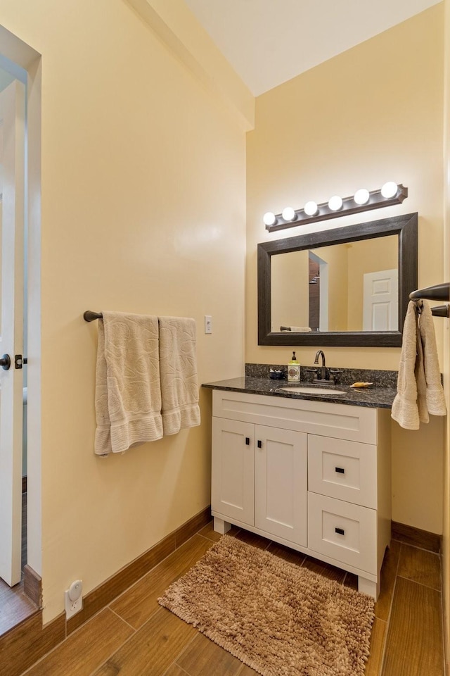 1829 Lobelville Hwy, Linden, TN 37096 - bathroom featuring wood finished floors, vanity, and baseboards