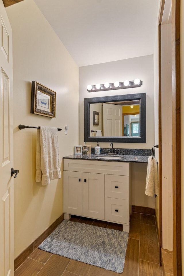 1829 Lobelville Hwy, Linden, TN 37096 - bathroom with wood finish floors, vanity, and baseboards