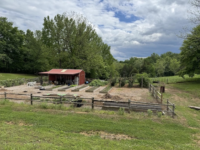 1829 Lobelville Hwy, Linden, TN 37096 - view of yard with an outdoor structure, a wooded view, and an outbuilding