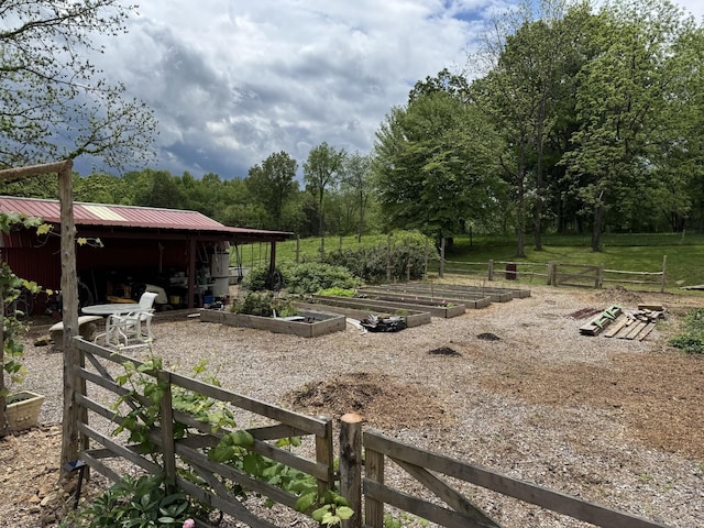 1829 Lobelville Hwy, Linden, TN 37096 - view of yard featuring a vegetable garden, a pole building, and an outbuilding