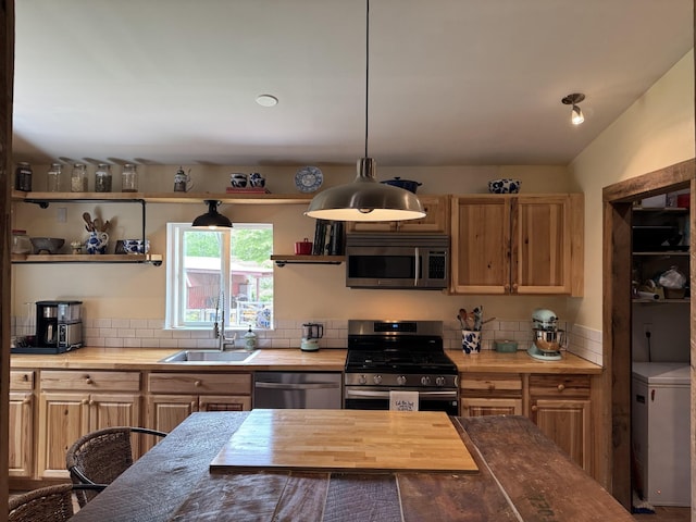 1829 Lobelville Hwy, Linden, TN 37096 - kitchen featuring appliances with stainless steel finishes, a sink, open shelves, decorative backsplash, and pendant lighting