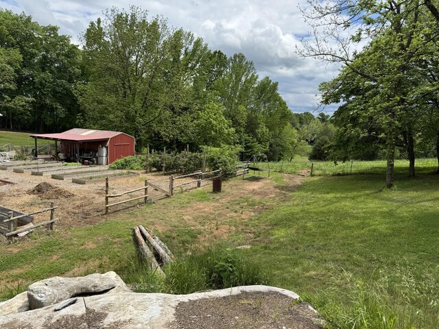 1829 Lobelville Hwy, Linden, TN 37096 - view of yard with a pole building, an outbuilding, a view of trees, a detached garage, and a view of rural / pastoral area