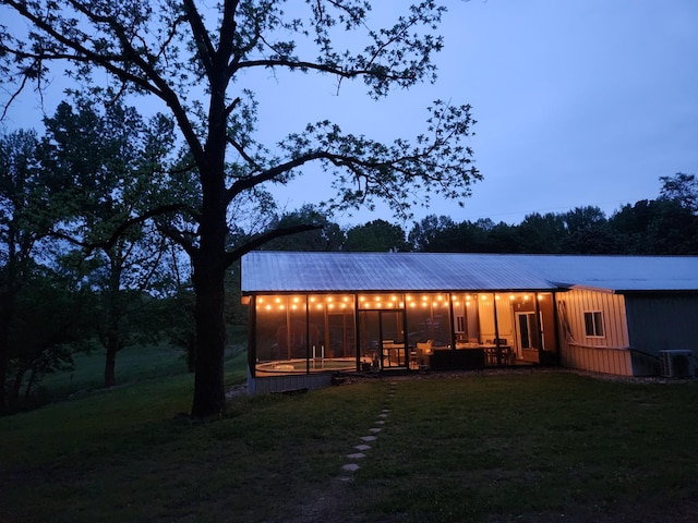 1829 Lobelville Hwy, Linden, TN 37096 - rear view of property featuring central AC unit, a yard, and metal roof