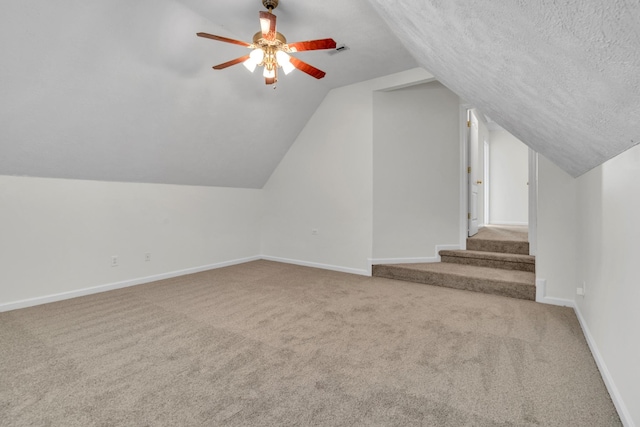 3471 Esquire Dr, Murfreesboro, TN 37130 - additional living space with carpet, vaulted ceiling, a ceiling fan, baseboards, and a textured ceiling