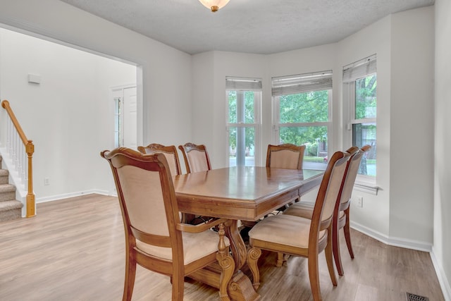 3471 Esquire Dr, Murfreesboro, TN 37130 - dining room featuring stairs, light wood-style floors, and baseboards