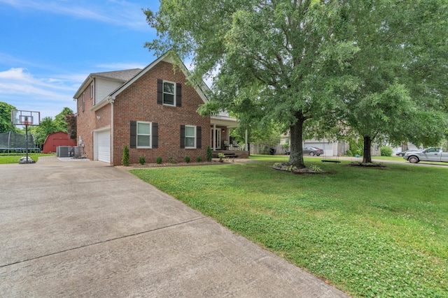 3471 Esquire Dr, Murfreesboro, TN 37130 - view of front of house featuring brick siding, driveway, a front yard, a trampoline, and cooling unit