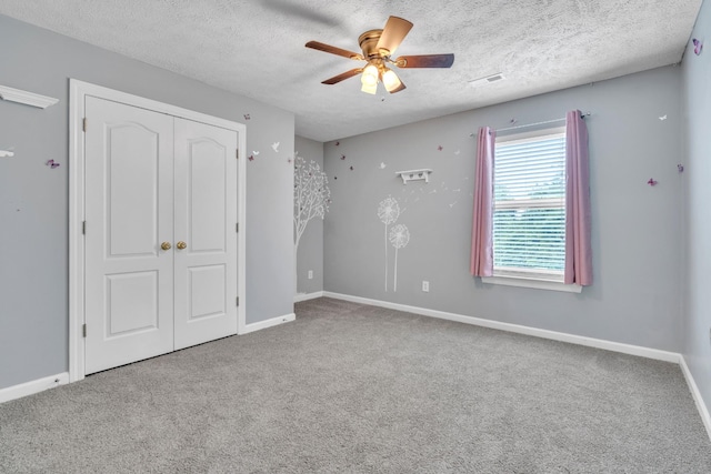 3471 Esquire Dr, Murfreesboro, TN 37130 - unfurnished bedroom featuring carpet flooring, baseboards, a textured ceiling, and a closet