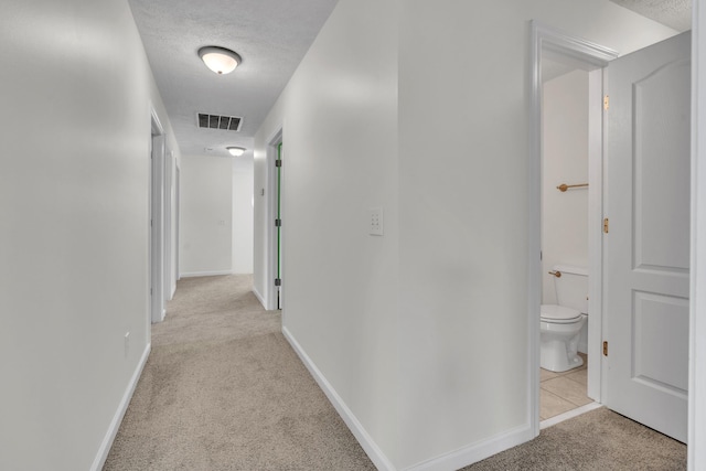 3471 Esquire Dr, Murfreesboro, TN 37130 - hall with light carpet, a textured ceiling, and baseboards