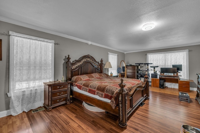 1151 Baker And Hearn Cir, Chickamauga, GA 30707 - bedroom featuring wood finished floors, crown molding, baseboards, a textured ceiling, and a desk