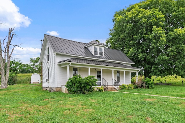 1672 Globe Rd, Lewisburg, TN 37091 - view of front of home featuring a porch, a front yard, and metal roof