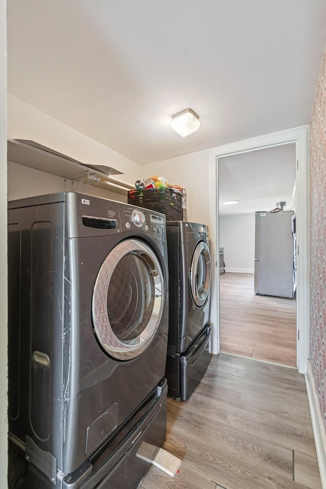1672 Globe Rd, Lewisburg, TN 37091 - washroom with washer and dryer, wood finished floors, and baseboards