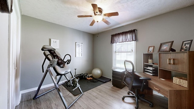 813 Chaney Woods Dr, La Vergne, TN 37086 - office space with wood finished floors, ceiling fan, a textured ceiling, and baseboards