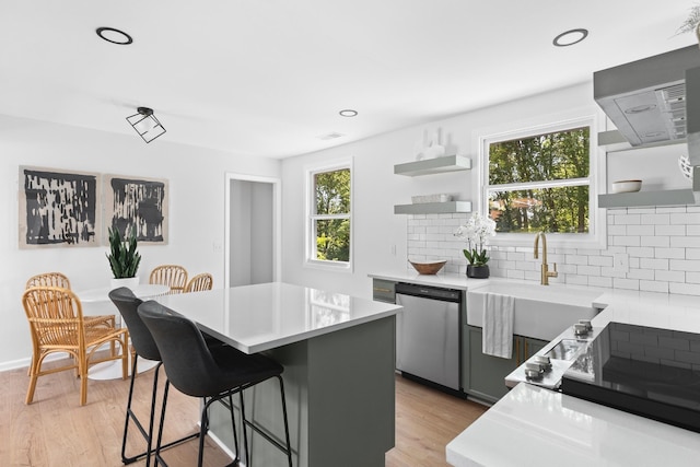 373 Kingview Dr, Nashville, TN 37218 - kitchen featuring dishwasher, open shelves, a sink, a kitchen breakfast bar, and recessed lighting