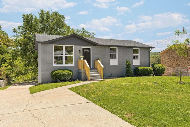 373 Kingview Dr, Nashville, TN 37218 - single story home featuring brick siding, a front yard, and a shingled roof