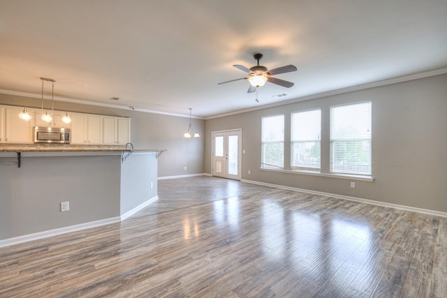 21 Cypress Hill Dr, Lebanon, TN 37087 - unfurnished living room featuring ornamental molding, a ceiling fan, wood finished floors, and baseboards